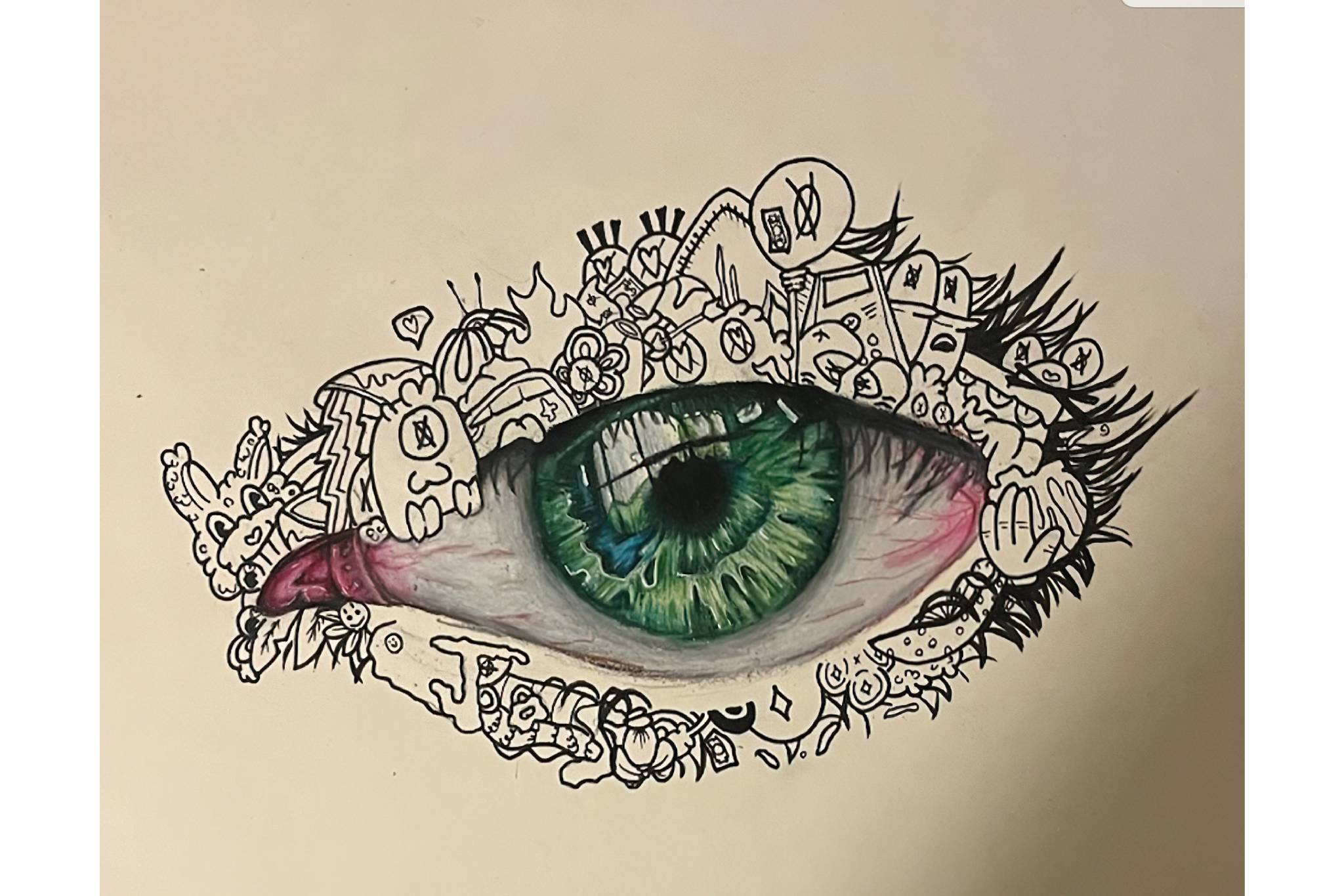 A detailed green eye surrounded by intricate black and white doodles.