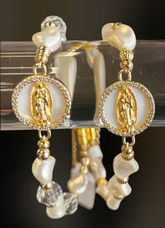 Elegant earrings featuring golden religious figures and pearl accents.