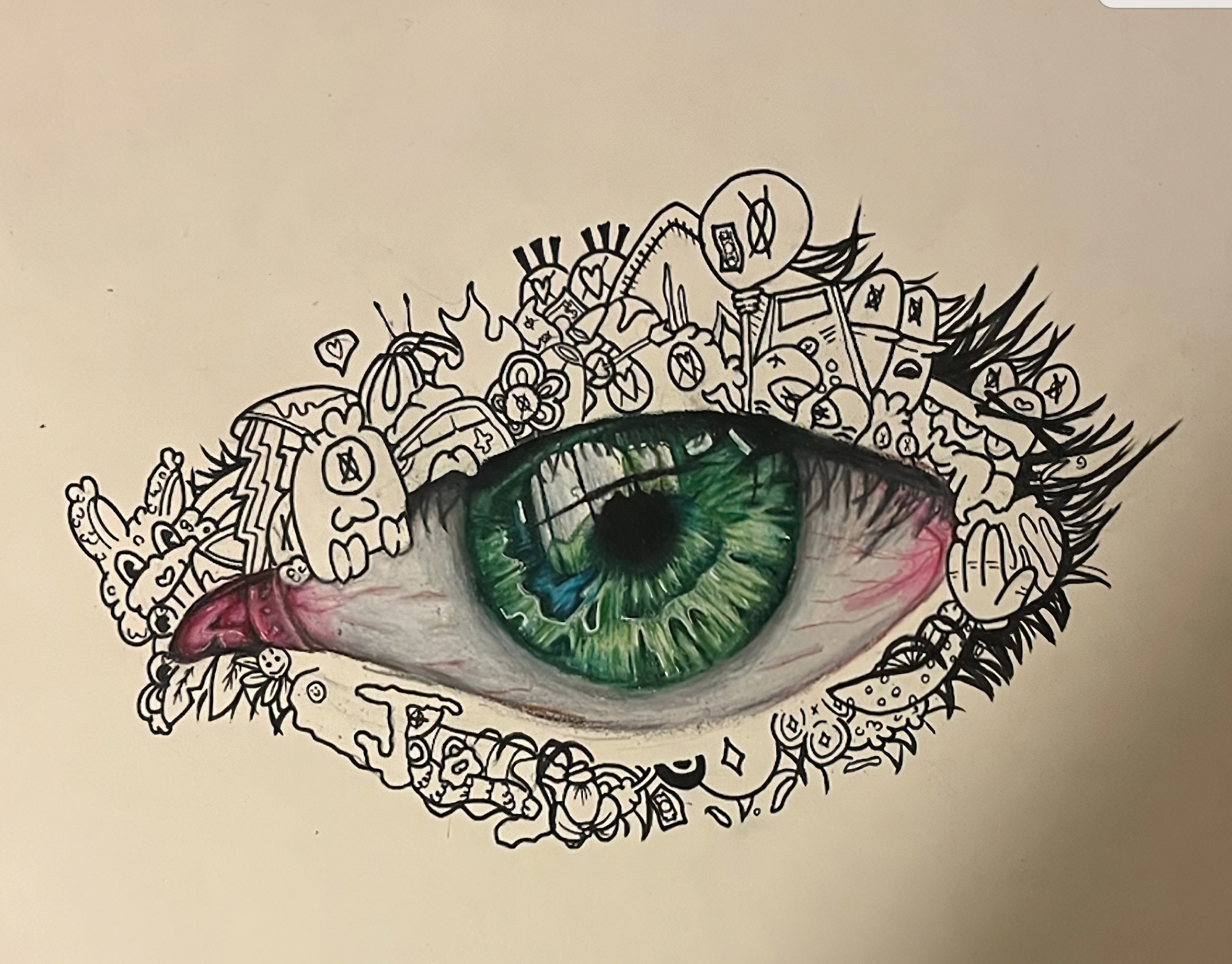 A detailed green eye surrounded by intricate black doodles and designs.